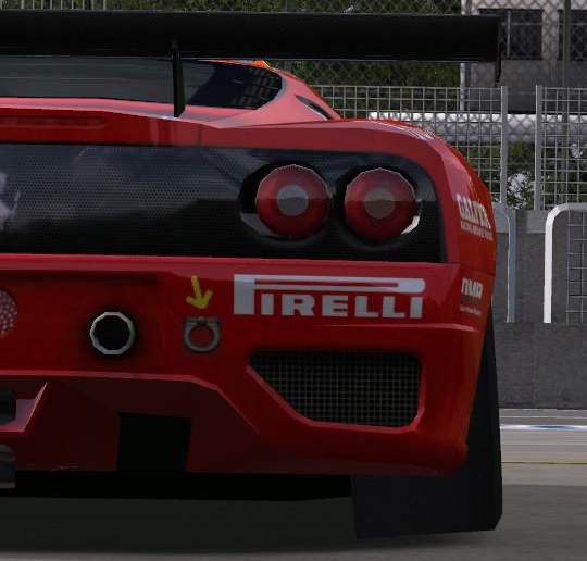 The rear of a red Ferrari 360 racing car. The rear wheels are angled leaning into the car, showing significant negative rear camber.